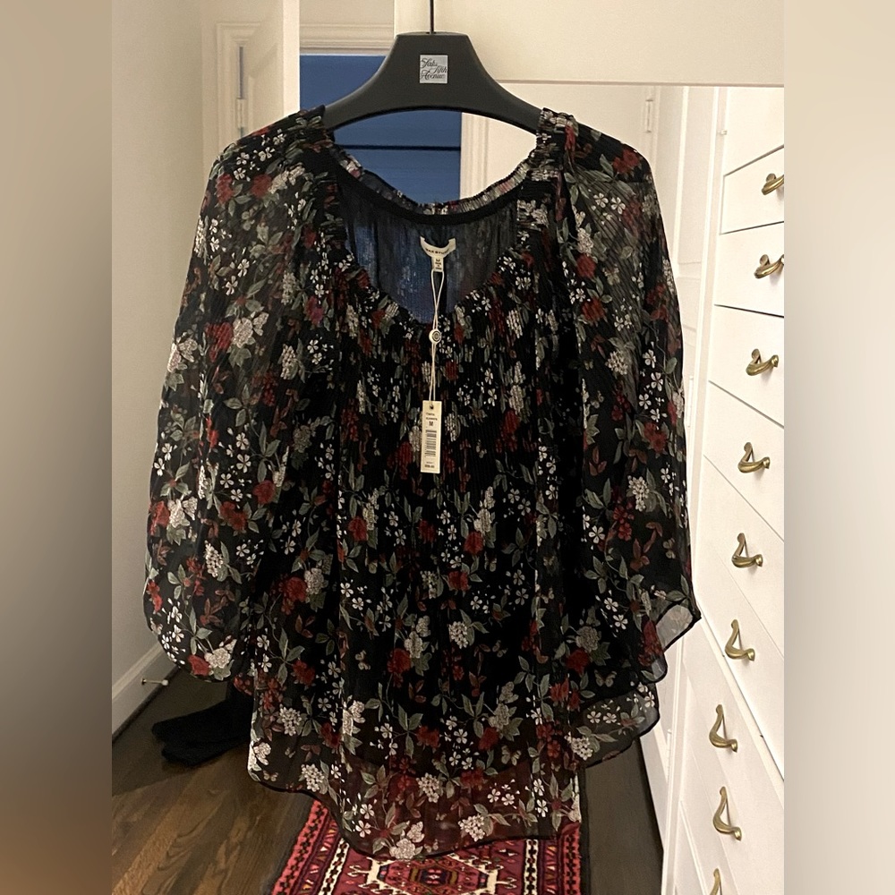 Max studio new with tags beautiful black blouse with a flowered pattern.